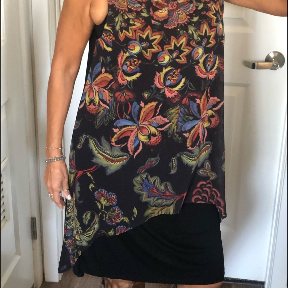 Summer dress, knee high, flows beautifully. Can dress it up or down. Imported.